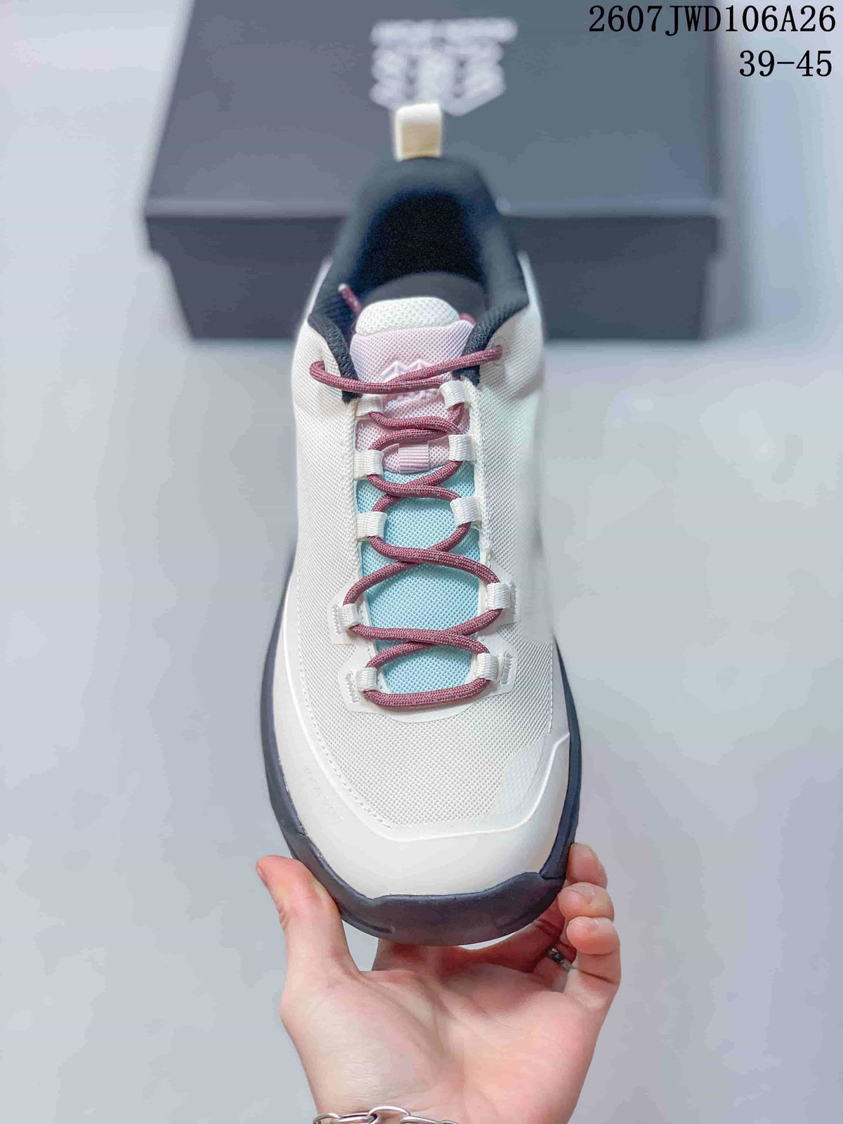 Top view of the hiking shoe showing the white upper, pink laces, pale blue tongue area and dark collar.