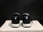Rear view showing contrasting heel graphics, padded collars, and layered white midsoles.