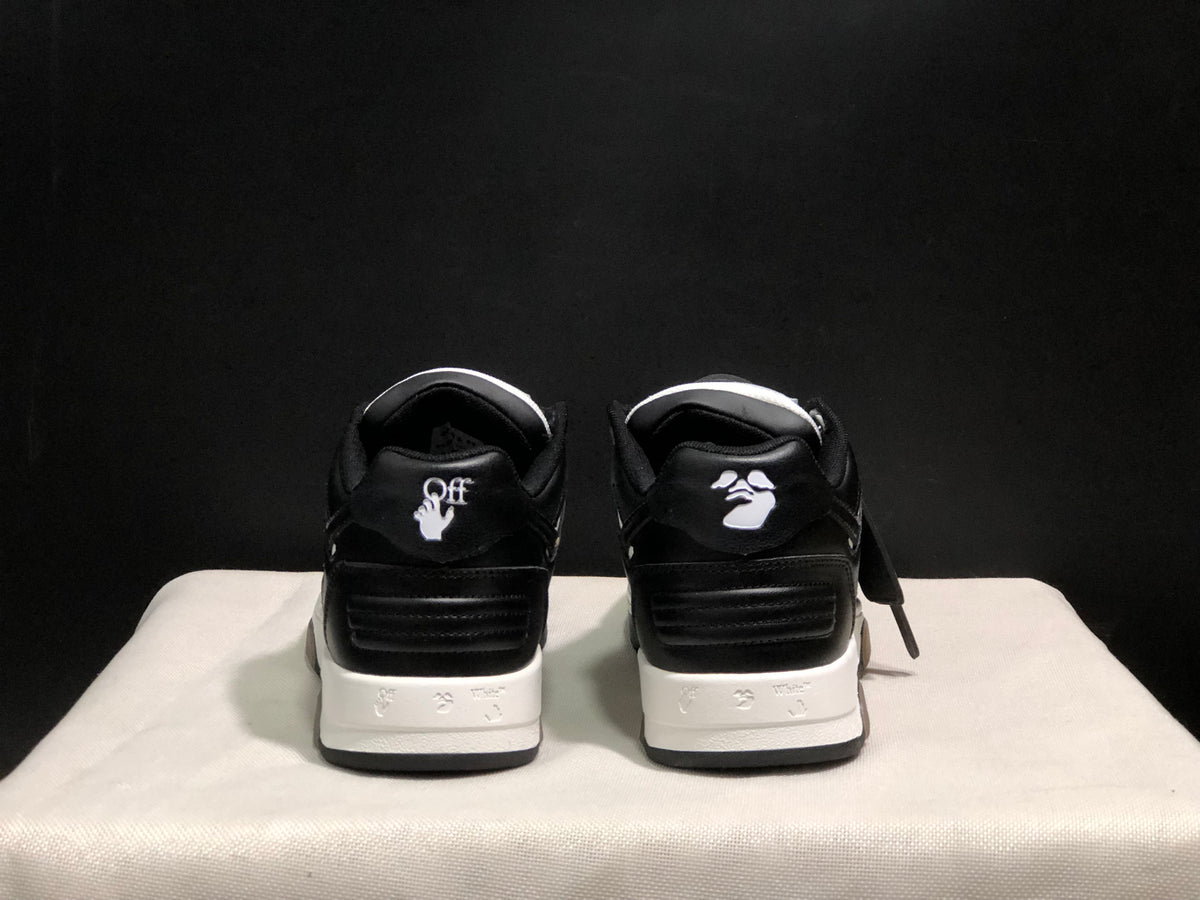 Rear view showing contrasting heel graphics, padded collars, and layered white midsoles.