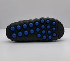 Outsole view showing multiple blue rounded pods across the black sole.