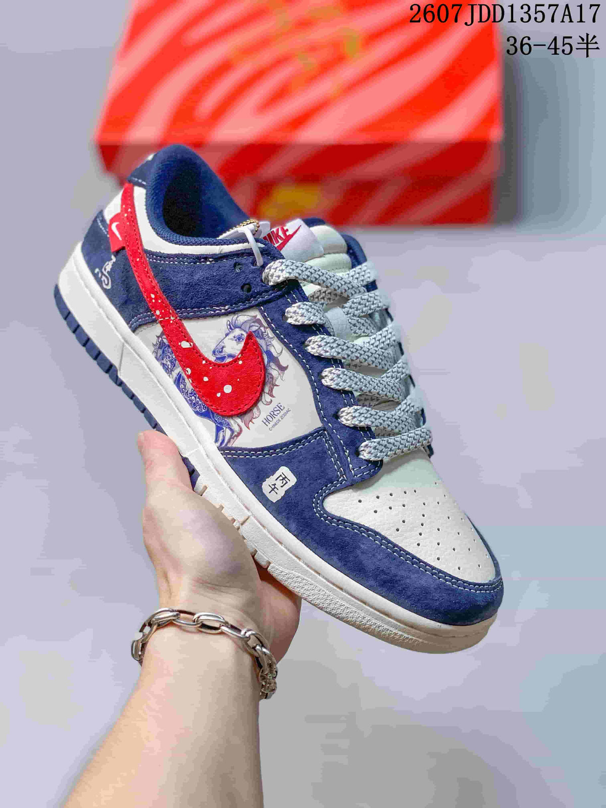 Blue, white and red low-top sneaker with horse artwork, contrasting laces and a dark blue outsole.