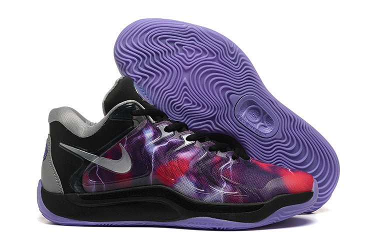 Black and purple Nike KD 17 basketball shoes with a vivid patterned upper and purple outsole.