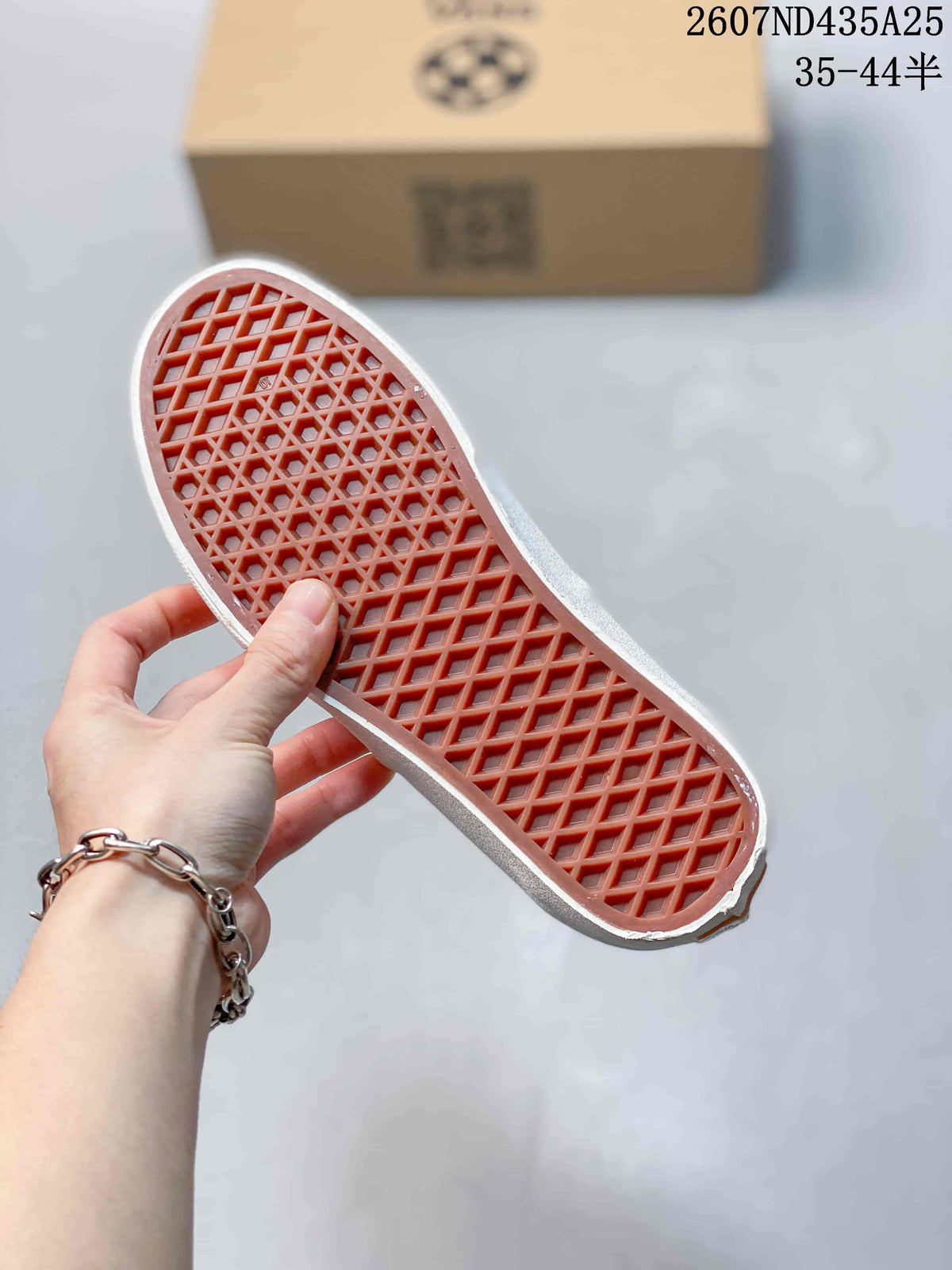 Underside of the sneaker showing the textured waffle-pattern outsole.
