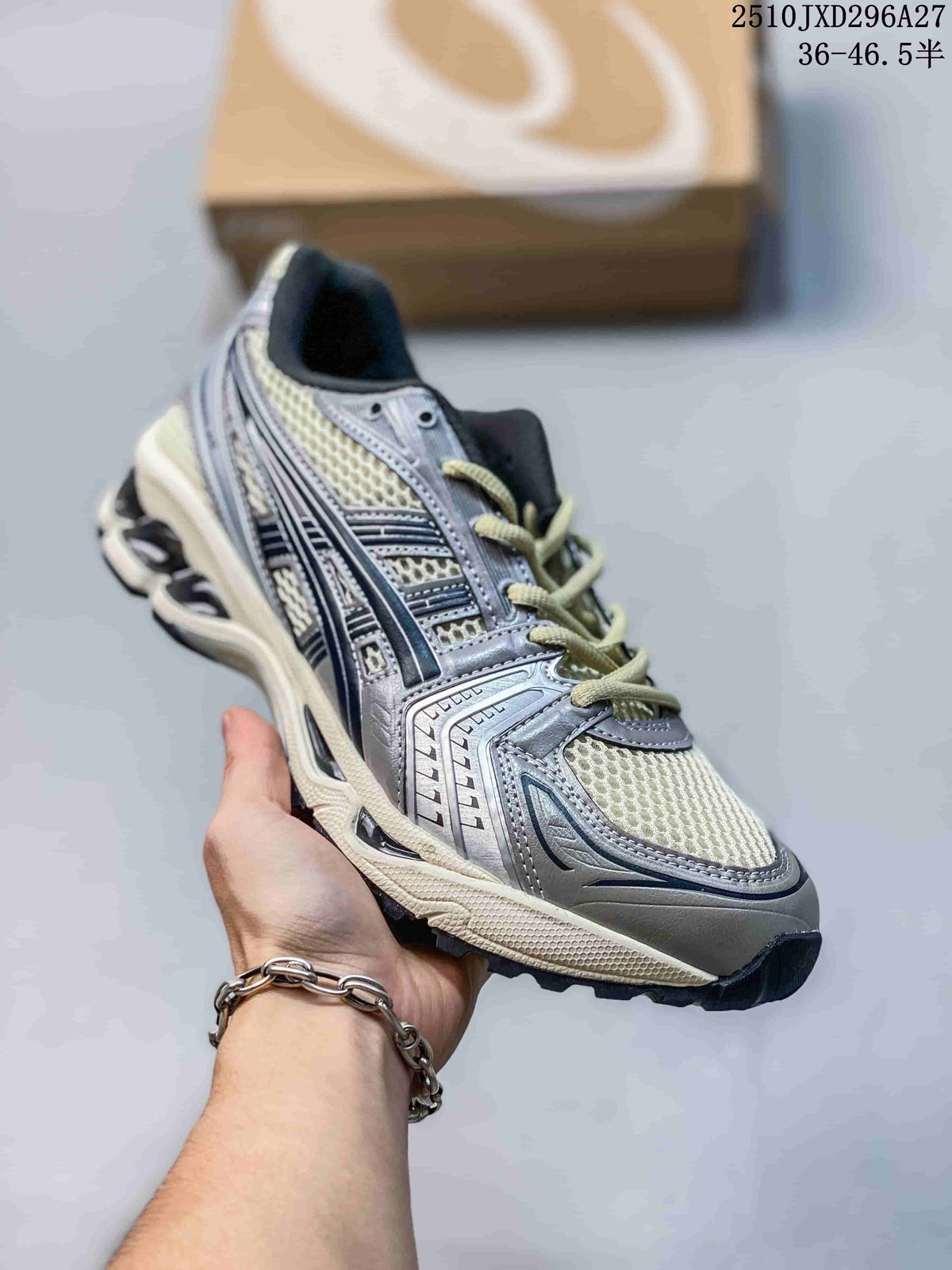 Silver and cream mesh sneaker with dark accents and a sculpted sole