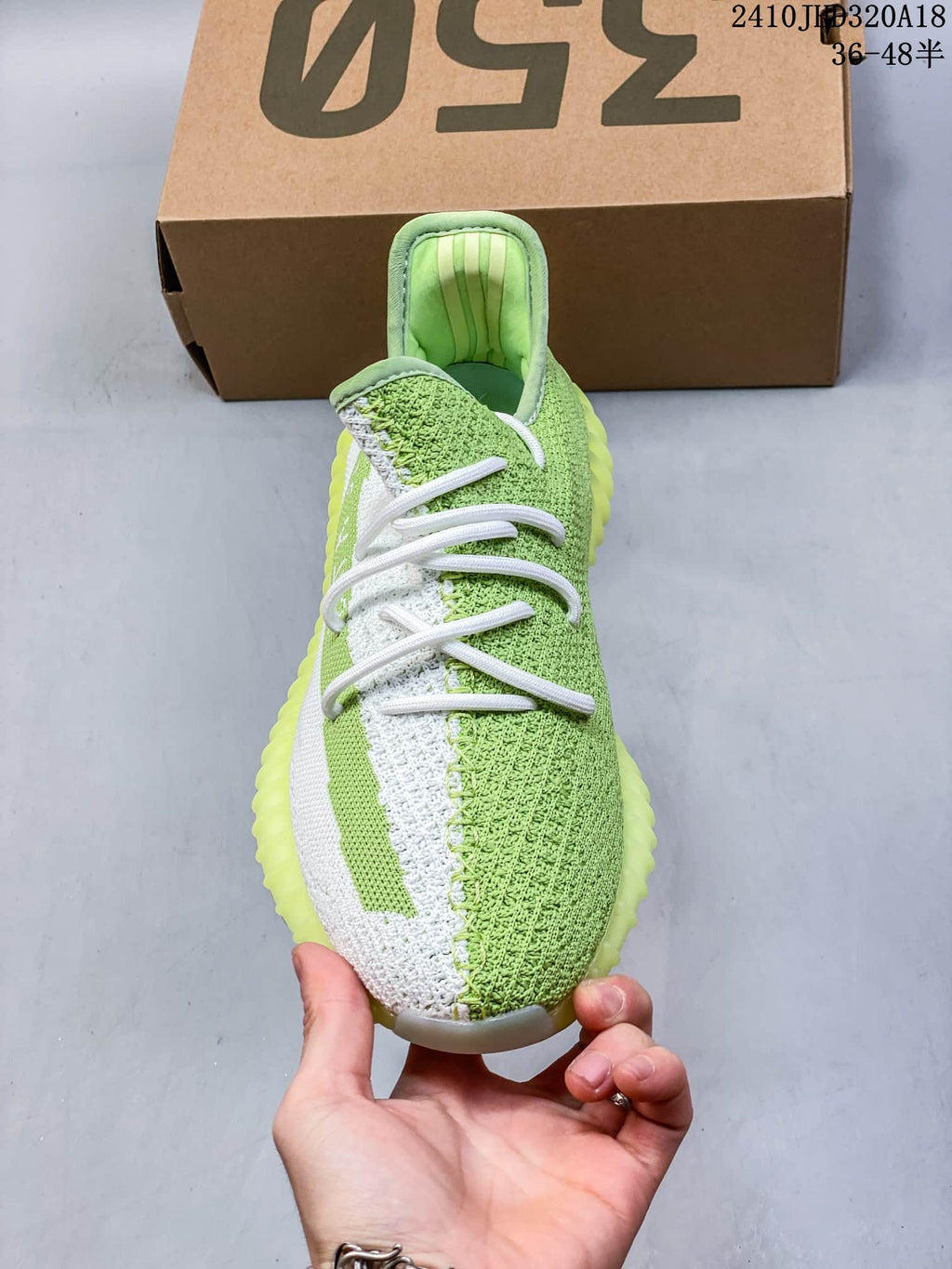Top view showing the white laces, contrasting side stripe, and two-tone knit upper.