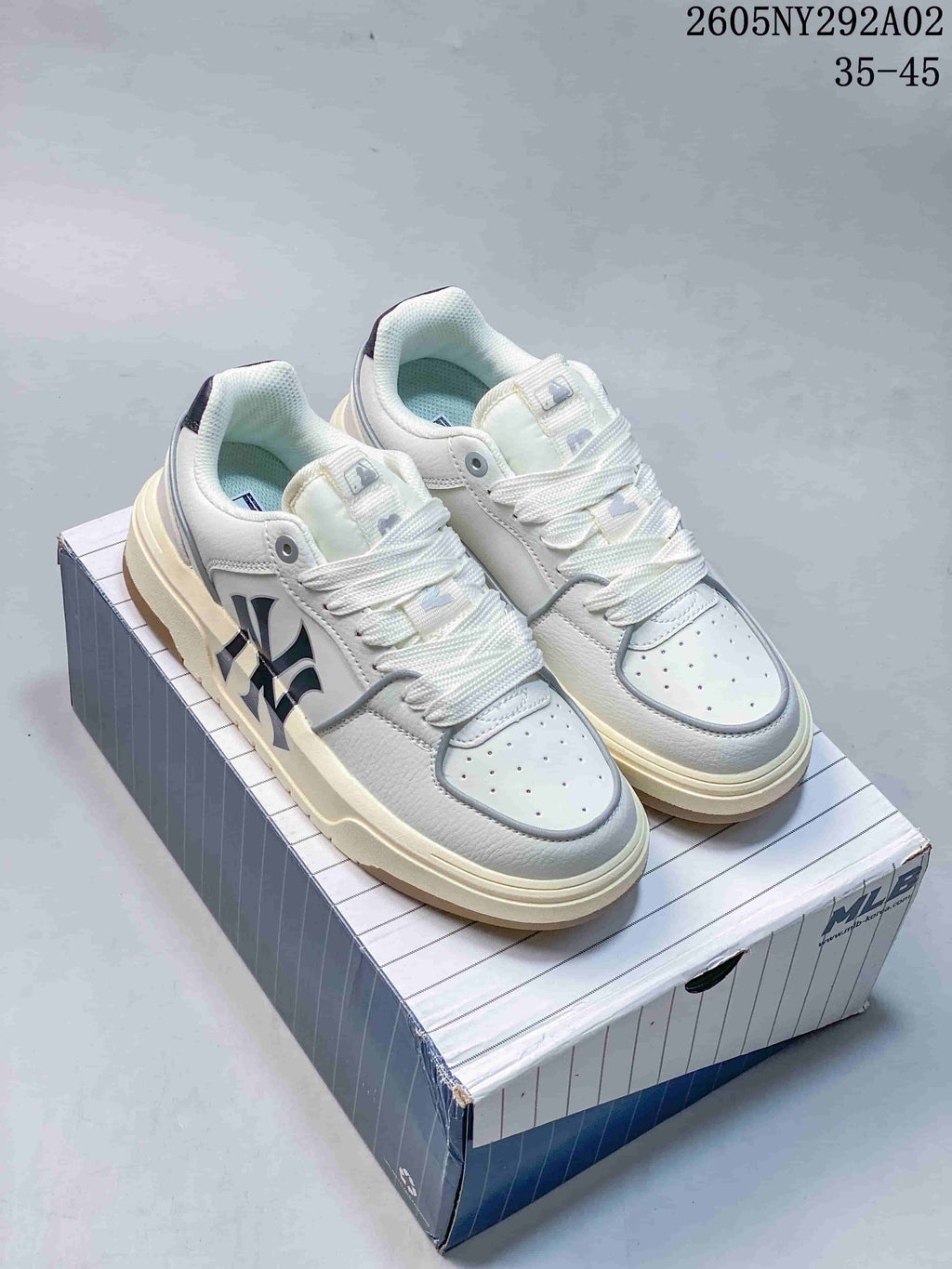Pair of white MLB Chunky Liner sneakers with gray accents