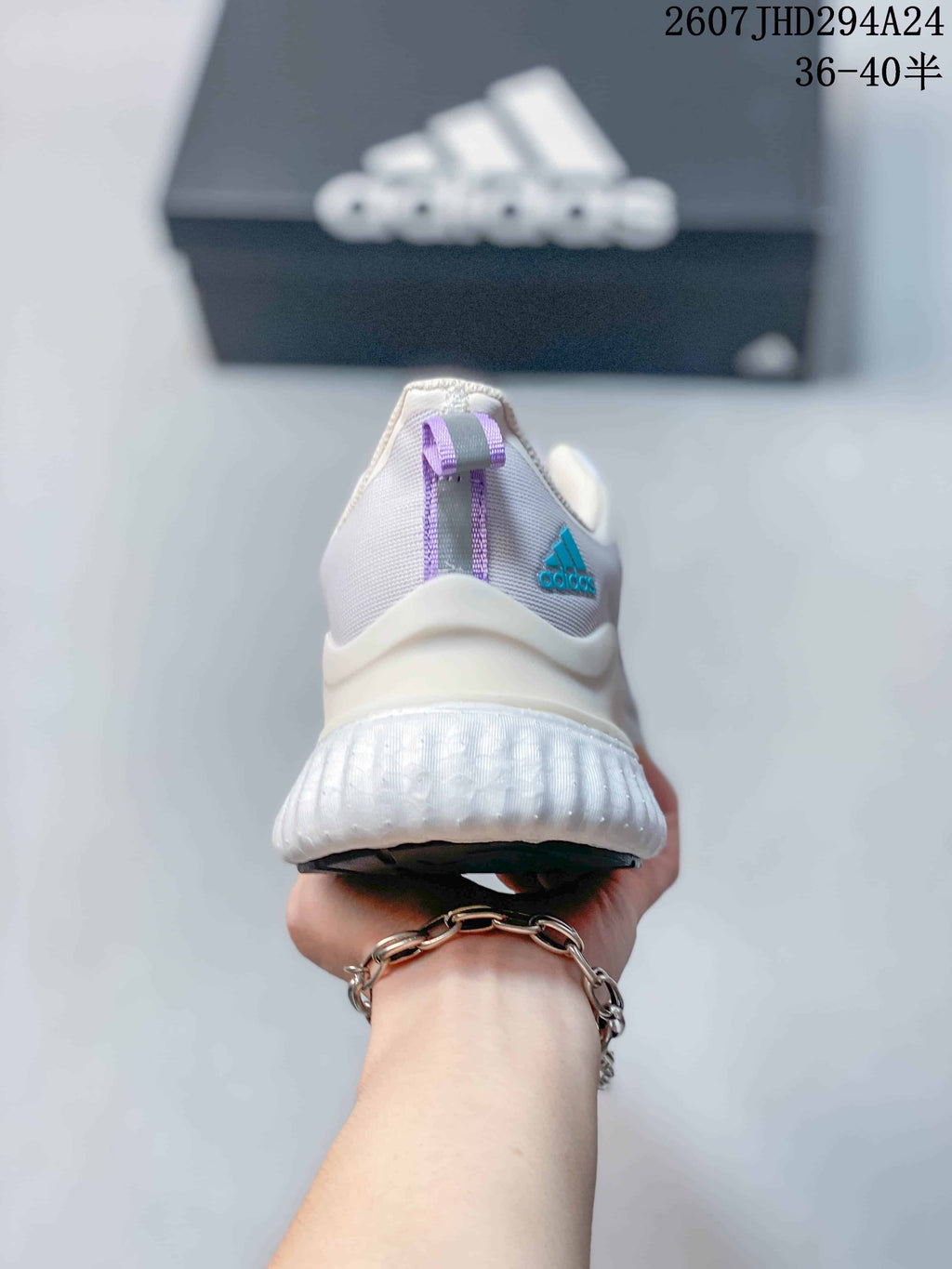 Rear view showing the padded heel, molded-looking heel structure, and thick white sole.