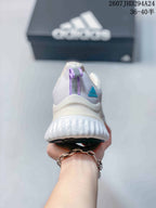 Rear view showing the padded heel, molded-looking heel structure, and thick white sole.