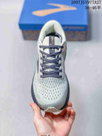 Top view showing the perforated-looking grey upper, dark laces, and padded tongue.