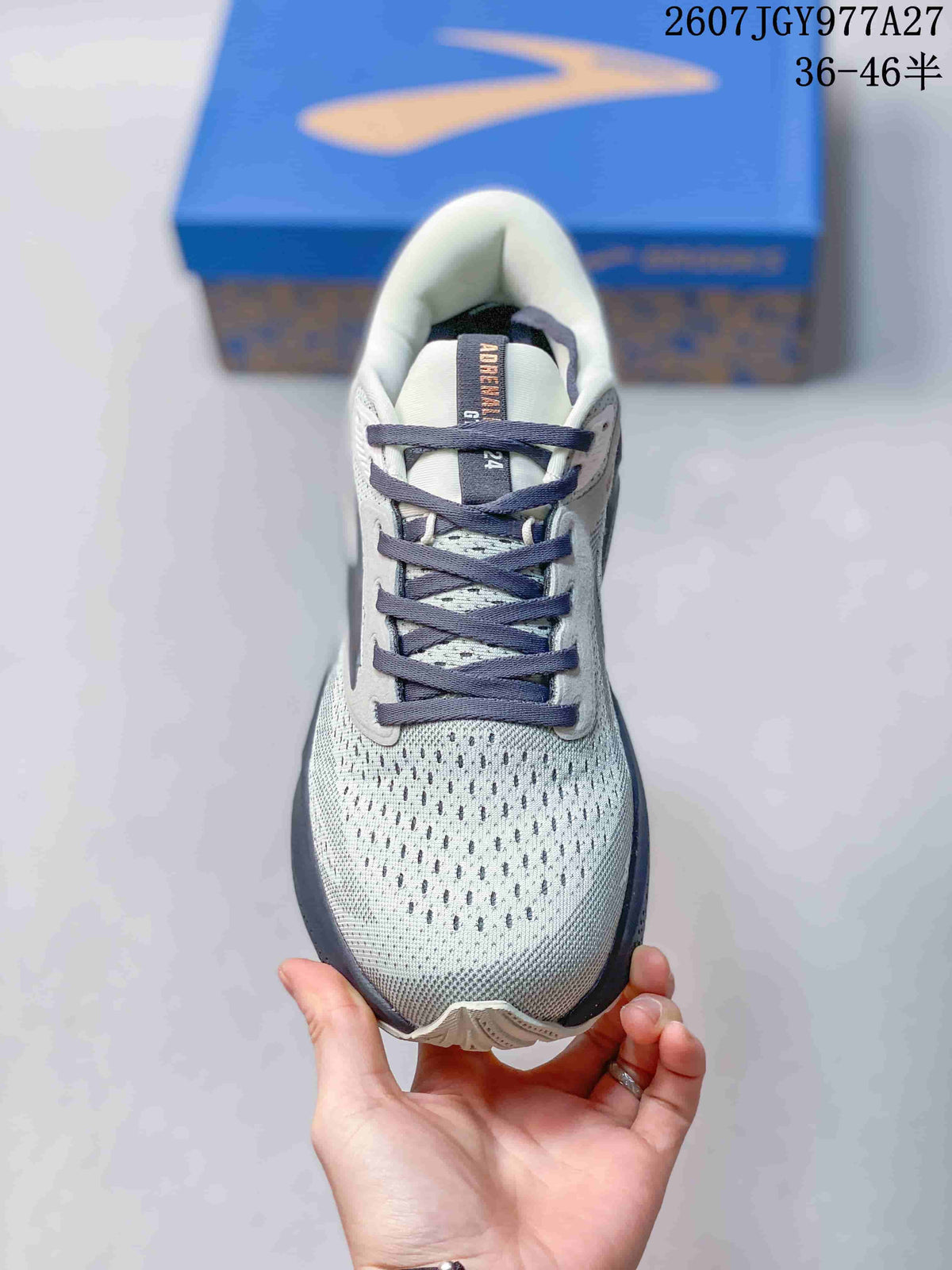 Top view showing the perforated-looking grey upper, dark laces, and padded tongue.