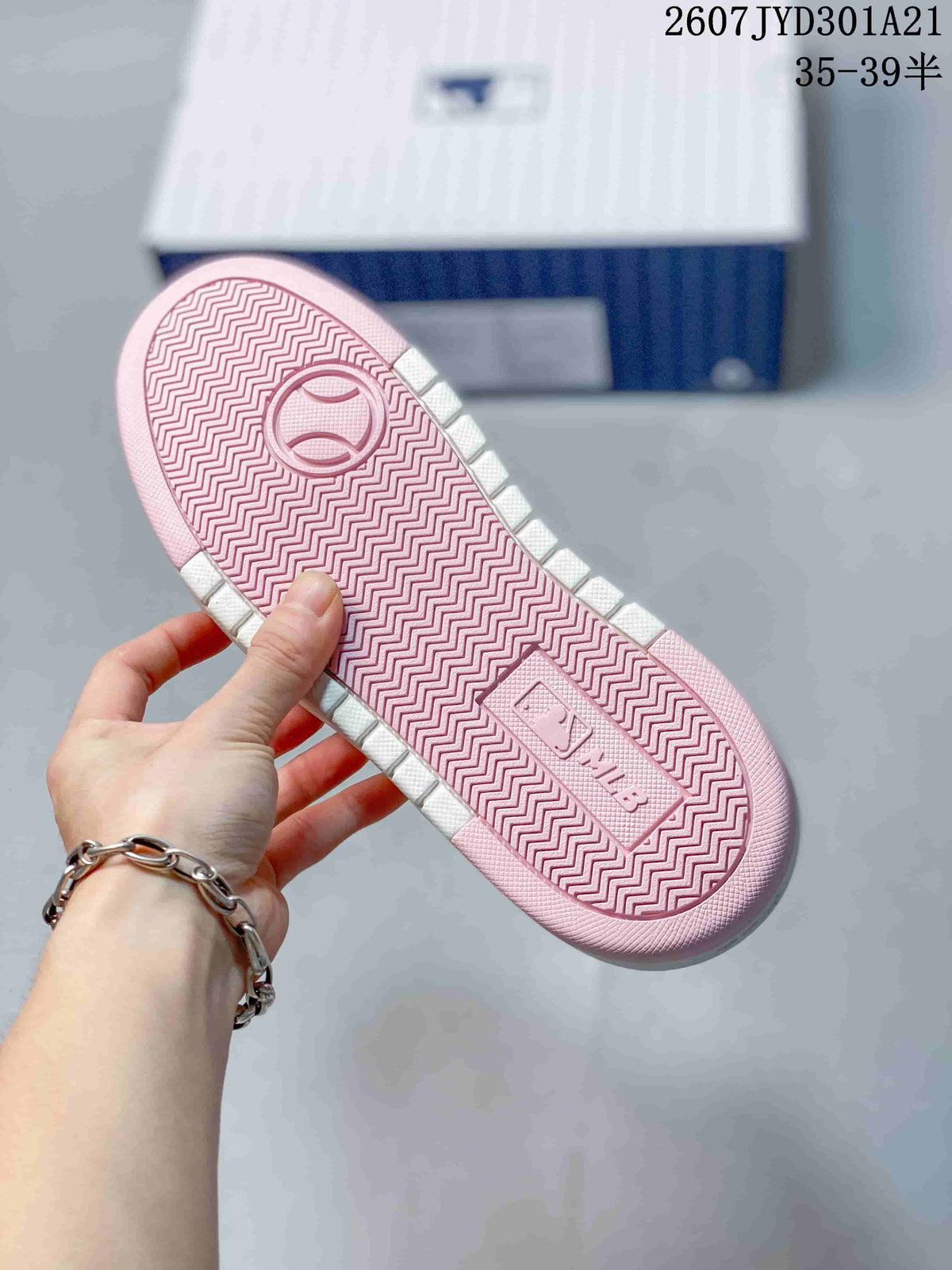 Close-up of the pink outsole showing a zigzag tread pattern and molded detailing.