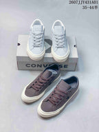 Light blue and gray Converse One Star low-top sneakers displayed together
