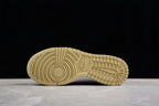 Underside view showing the cream rubber outsole with circular pivot detailing and patterned tread.