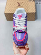 Top view of the sneaker showing the purple toe area, pink edging, white laces, and large LV tongue emblem.