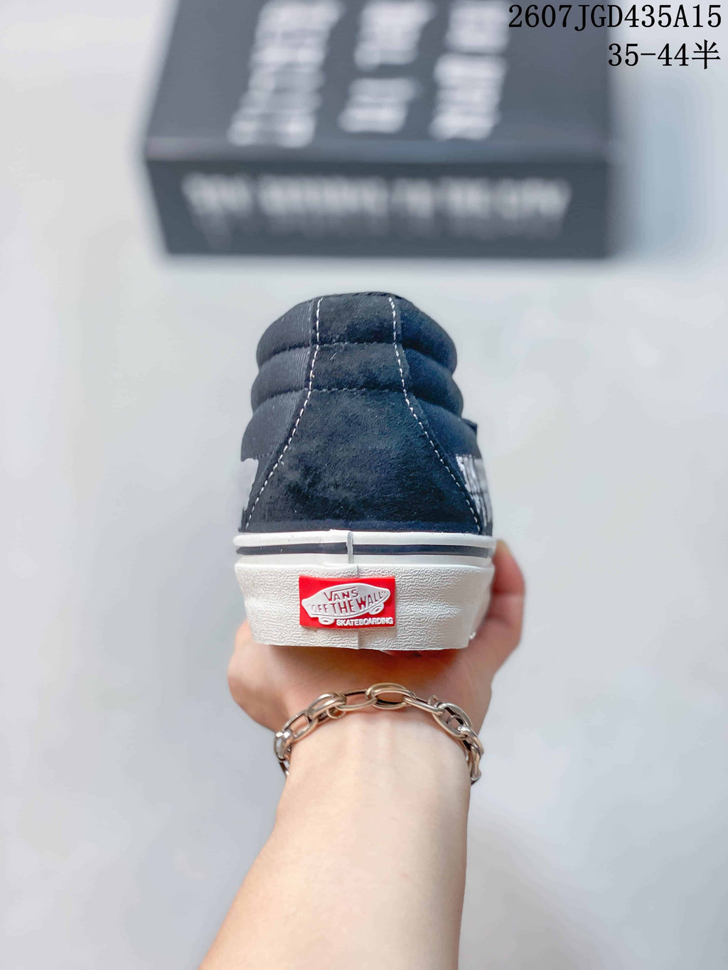 Rear view showing the padded black collar, white sole and red Vans heel label.