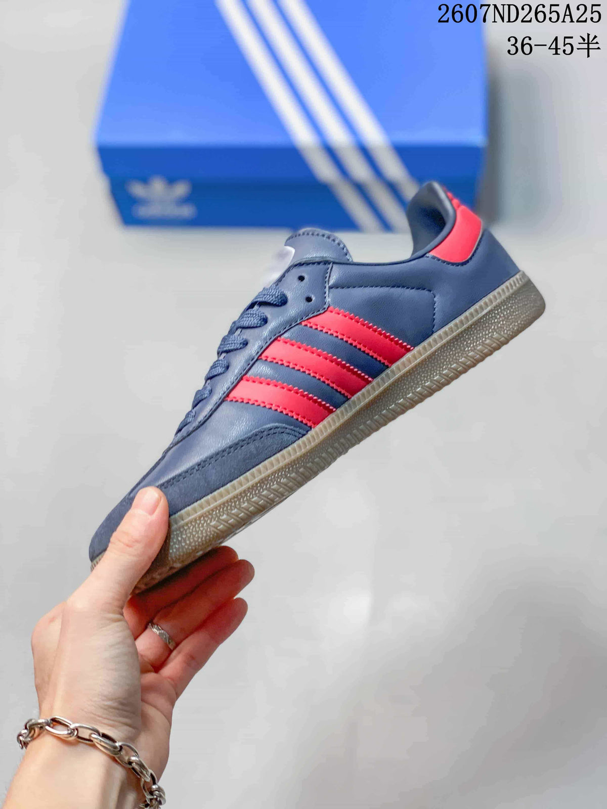 Side profile of the navy sneaker with red three-stripe detailing, stitched panels, and a gum-colored sole.