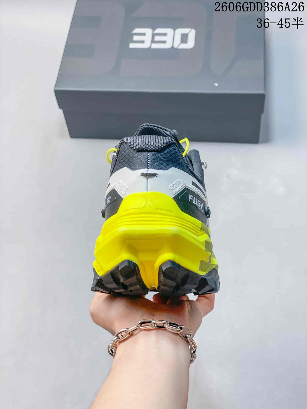 Rear view showing the heel and neon yellow midsole of a Kailas FUGA EX330 shoe