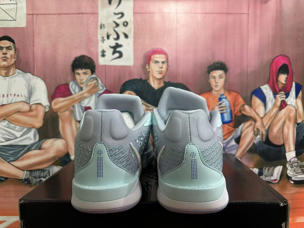 Rear view of light blue and gray Nike basketball shoes