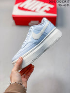 Side profile of the sneaker showing the white Swoosh, layered upper and platform-style sole.