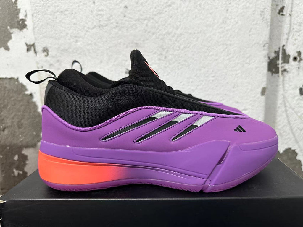 Side view of a purple adidas Dame 9 shoe with metallic-look stripes and coral heel accent