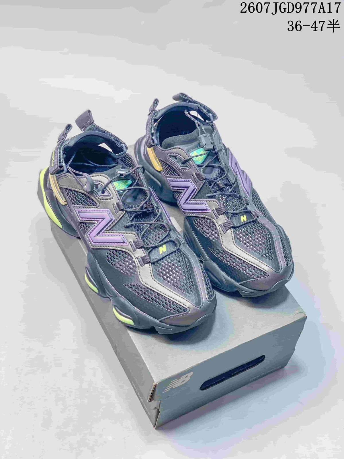 Pair of black, purple and fluorescent yellow New Balance 9060 sneakers displayed on a shoebox; image text shows style code 2607JGD977A17 and size range 36–47 with half sizes.