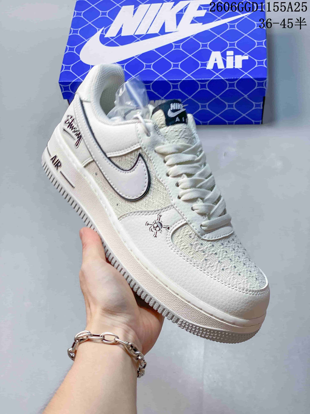 Angled side view showing the off-white upper, skull graphic, Swoosh, and heel lettering.
