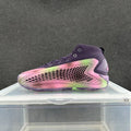Pink and purple high-top sneaker with a honeycomb-patterned side panel, photographed from the side.