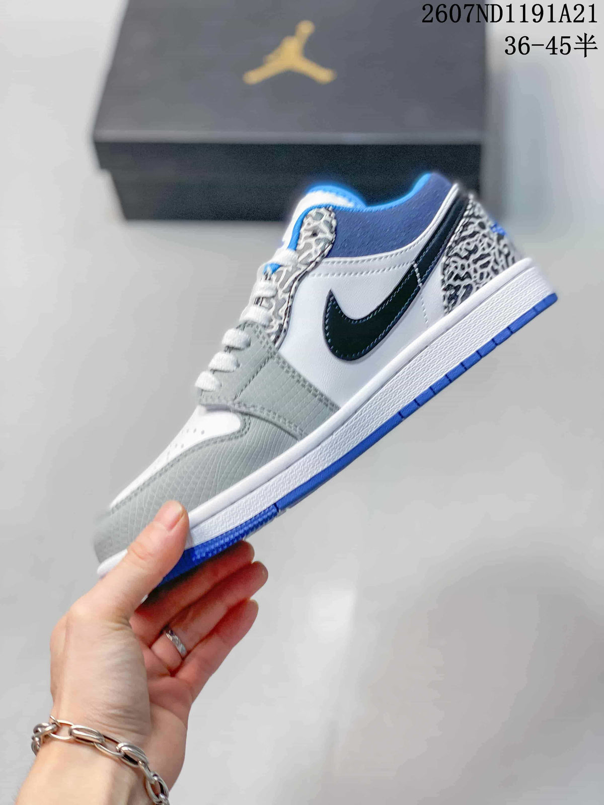 Side profile showing the black Swoosh, white quarter panel, grey overlays, elephant-print eyestay and blue outsole.