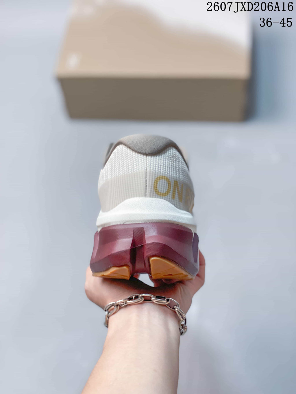 Rear view showing the padded heel, On branding and contrasting outsole structure.