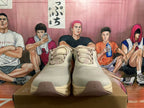 Front view of beige lace-up sneakers with patterned uppers