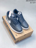 Pair of dark navy and white Nike Court Vision Low sneakers displayed on a shoebox.
