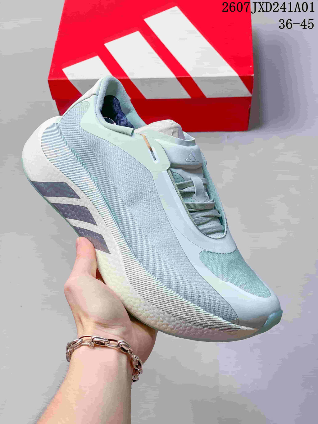 Several adidas Hyperboost Edge M shoes arranged in a circle, shown in assorted colors.