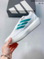 Side view of the white running shoe with teal stripes