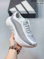 Angled side view of the white and grey Adidas HYPERBOOST EDGE W sneaker.