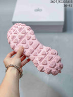 Close view of the pink sneaker outsole with a geometric lug pattern; image text shows code 2607JXD335A15 and sizes 36–41.