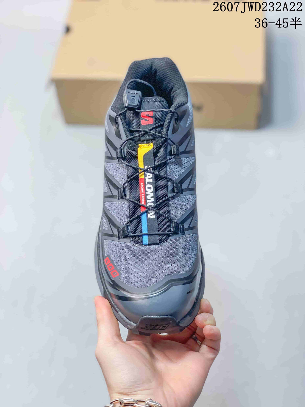 Top view showing the quick-lace style fastening, lace-lock component, padded tongue, and red and blue details.