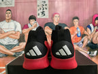 Rear view showing white Adidas stripes on the black heel panels.