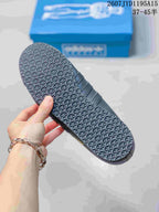 Close view of the sneaker outsole showing a dense geometric tread pattern.