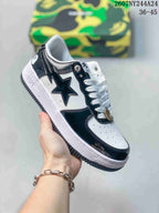 White low-top sneaker with glossy black star graphic, white laces and white sole; source overlay shows style code 2607NY244A24 and size range 36–45.