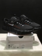 Three-quarter product view of the pair on the shoebox, with the Nike Mind 002 label and style code visible.