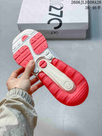 Underside of a Nike Air Max 270 Premium sneaker showing its red and white outsole