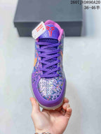 Top view of the purple basketball shoe showing the lacing system, tongue emblem and multicolor toe design.