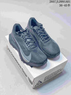 Pair of charcoal gray Nike ACG trail shoes with light accents