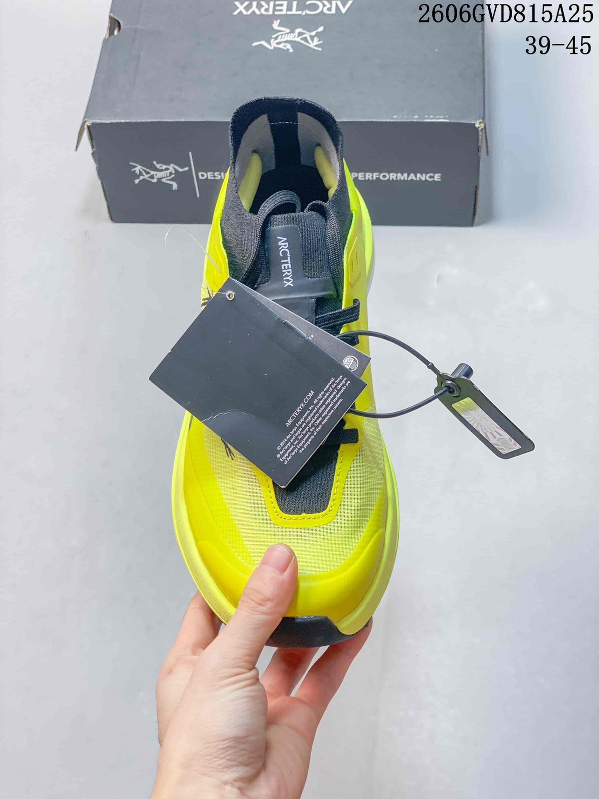 Top view of the neon yellow shoe with dark gray lacing and tongue