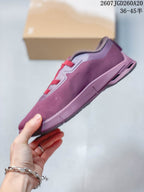 Side view of the plum-purple sneaker showing the layered sole, textile-looking upper, and sculpted heel area.