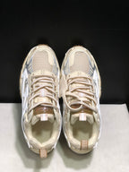 Top view showing the rounded toe boxes, lace-up closure, padded collars, and tongue details.