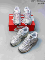 Multiple views of white, silver and pink Nike P-6000 sneakers arranged around a red Nike shoebox.