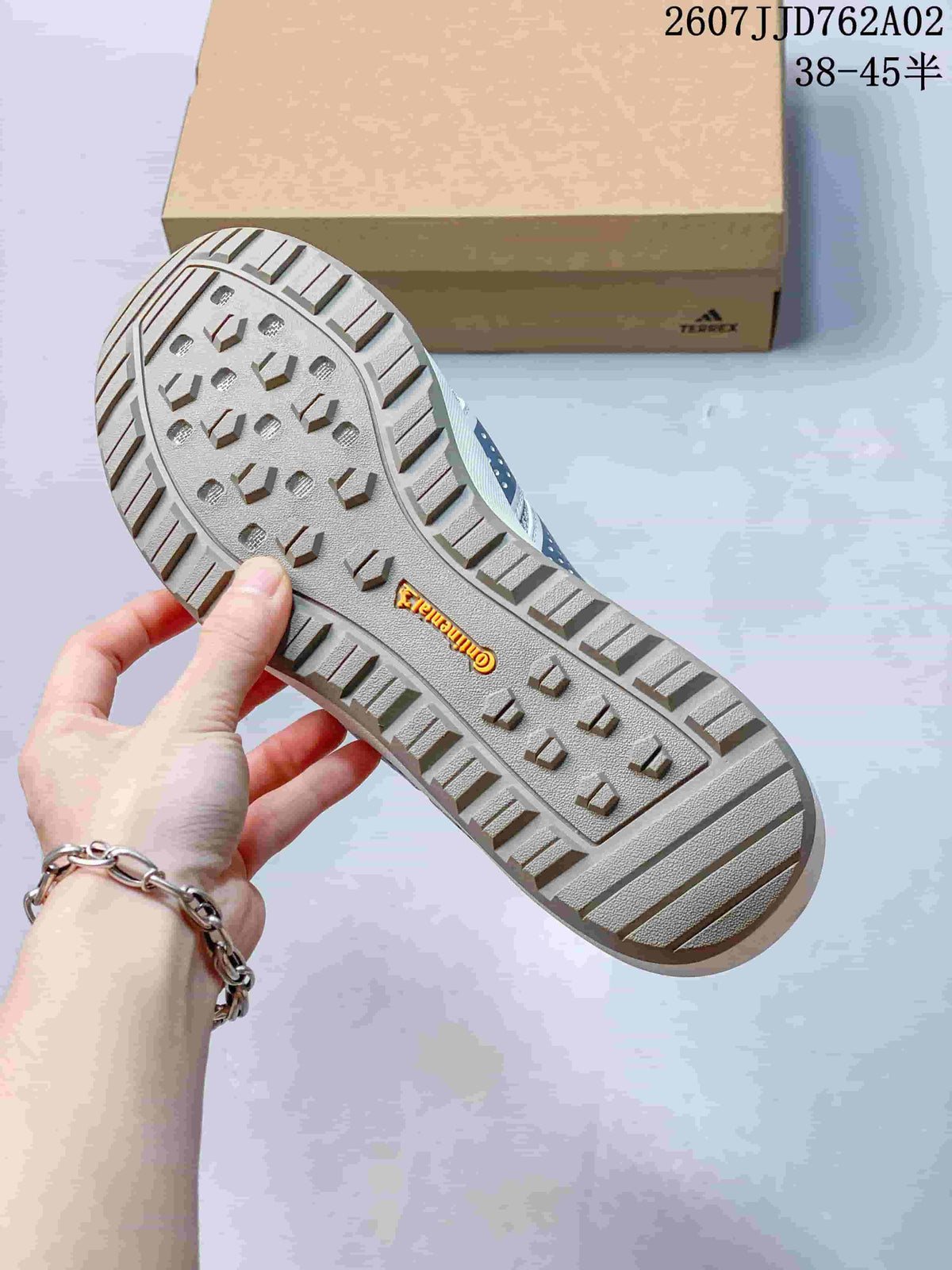Close view of the shoe outsole with raised tread pattern.