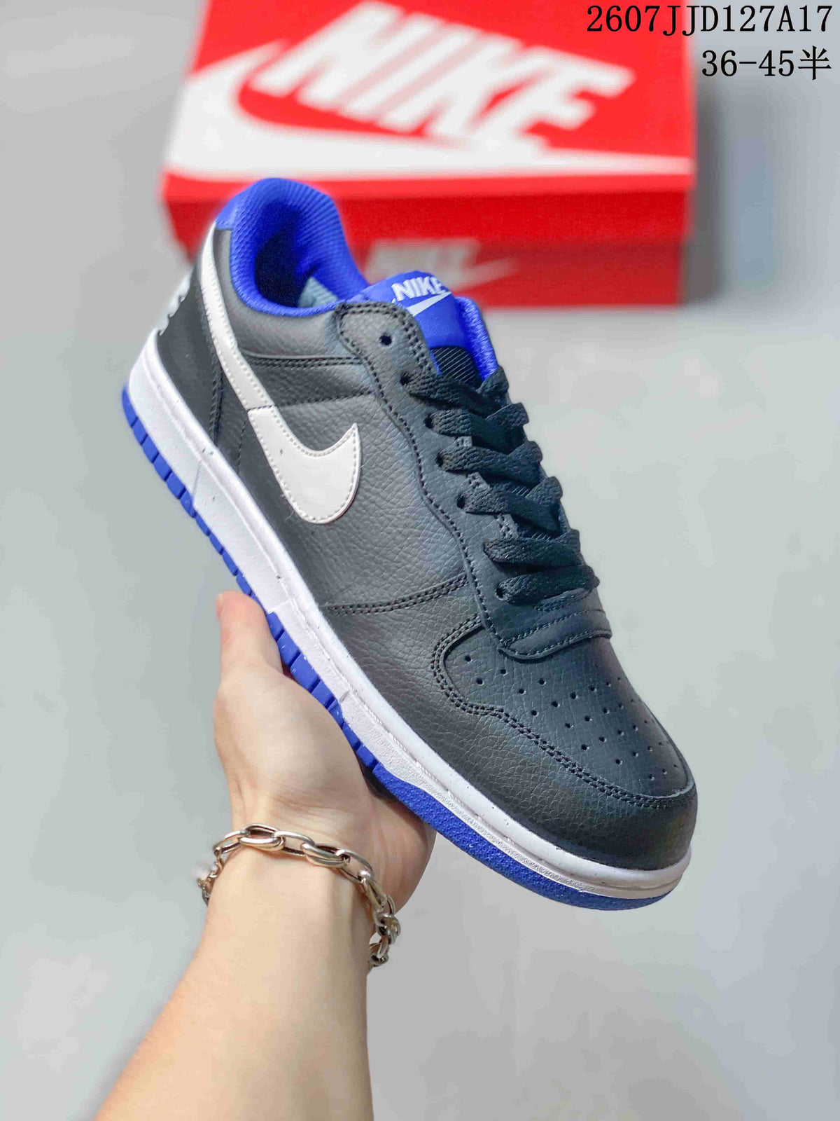 Angled side view highlighting the black upper, white Swoosh panel, blue collar lining, and blue outsole.