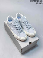 Light blue Converse One Star low-top sneakers with white sole on a shoebox